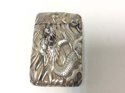 Lot 167 - Chinese white metal vesta case of conventional form with embossed dragon decoration, and hinged cover, 5cm in length