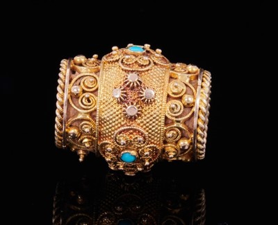 Lot 351 - Regency gold and turquoise slide, of barrel shape, the gold cannetille and filigree decoration with applied turquoise cabochons and rope twist border. 18mm