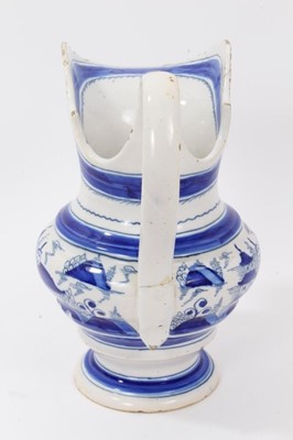 Lot 65 - 19th Century tin glazed pottery jug with blue and white chinoiserie decoration