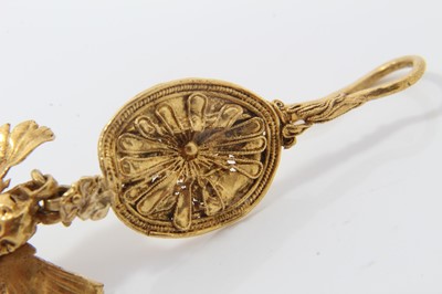 Lot 388 - Antique or possibly ancient gold earring, modelled as Eros or Cupid, the winged figure suspended from a rosette with hook fitting. Possibly Greek Hellenistic period circa 3rd or 4th century B.C. or...