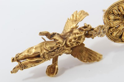 Lot 388 - Antique or possibly ancient gold earring, modelled as Eros or Cupid, the winged figure suspended from a rosette with hook fitting. Possibly Greek Hellenistic period circa 3rd or 4th century B.C. or...