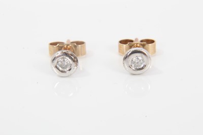 Lot 398 - Pair of diamond stud earrings, each with a round brilliant cut diamond weighing approximately 0.05cts in white gold setting