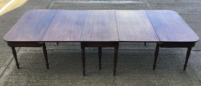 Lot 819 - Regency mahogany D-end dining table with central hinged section and twin D-ends, raised on ring turned legs, 312cm long x 128cm extended