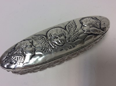 Lot 159 - Victorian silver backed hand mirror with ornate embossed decoration (Birmingham 1876), together with three silver backed brushes and two silver silver topped