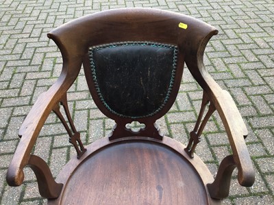 Lot 75 - Mahogany swivel elbow chair
