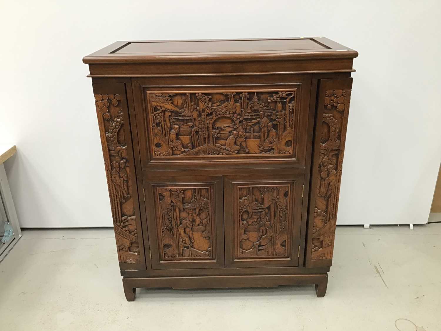 Lot 6 - Chinese carved wooden cocktail cabinet