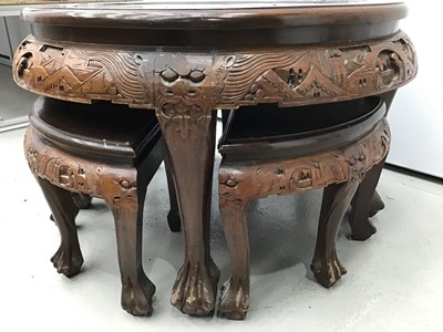 Lot 8 - Chinese circular carved coffee table with integral nest of tables