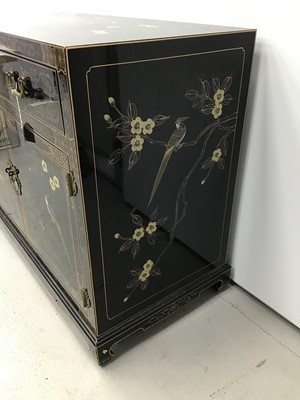 Lot 4 - Chinese black lacquered cupboard with chinoiserie gilded decoration, two drawers and cupboards below