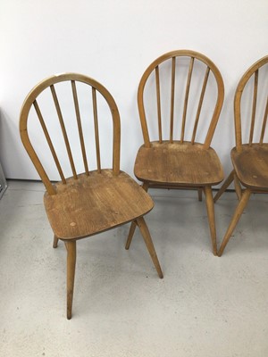 Lot 39 - Ercol golden dawn dining table and ensuite set of four chairs