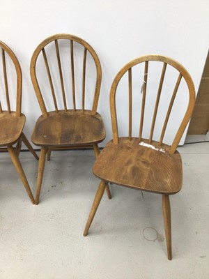Lot 39 - Ercol golden dawn dining table and ensuite set of four chairs