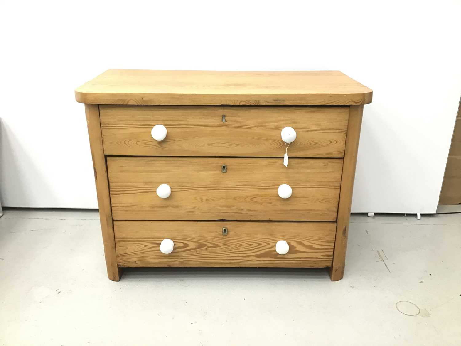 Lot 67 - Antique pine chest of three long drawers