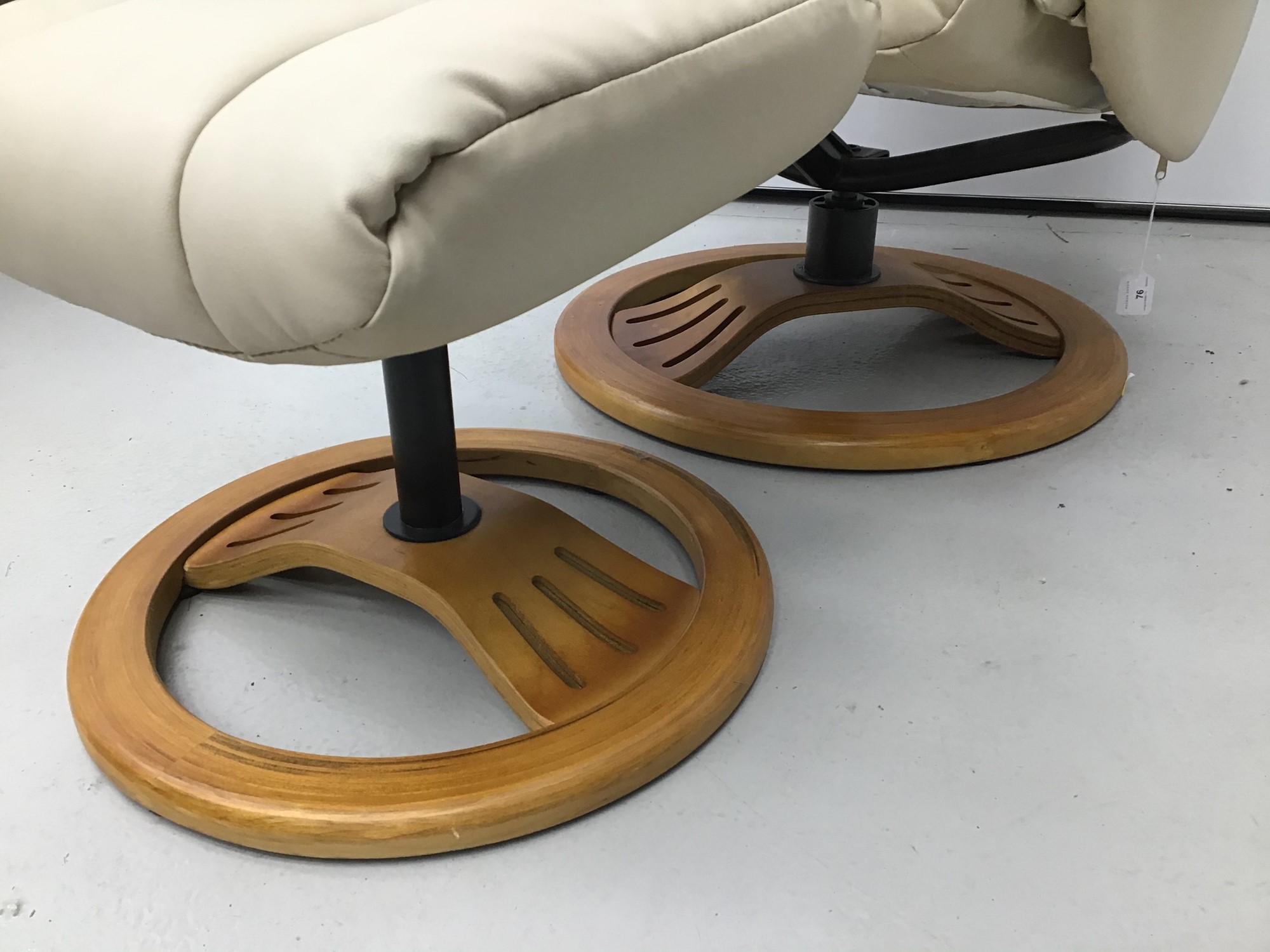 Lot 76 Cream leather easy chair and footstool