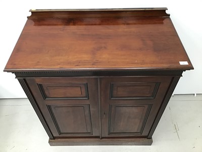 Lot 66 - Good quality Edwardian mahogany cupboard with dentil cornice, shelved interior enclosed by two panelled doors, 92cm wide x 107cm high x 47cm deep.