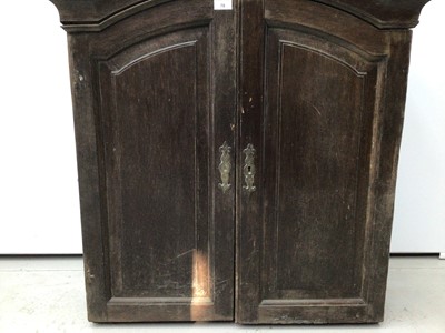 Lot 78 - 18th century French chestnut cabinet, arched form, e closed by pair of panelled doors, 81cm wide x 24cm deep x 106cm high