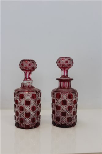 Lot 2072 - Pair of ruby cut glass decanters with stoppers