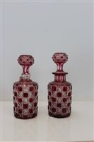 Lot 2072 - Pair of ruby cut glass decanters with stoppers