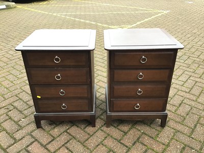 Lot 130 - Stag mahogany Minstrel bedroom furniture to include a pair of tall chest of drawers, pair of bedside chests of four drawers, and a long chest of drawers