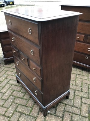 Lot 130 - Stag mahogany Minstrel bedroom furniture to include a pair of tall chest of drawers, pair of bedside chests of four drawers, and a long chest of drawers