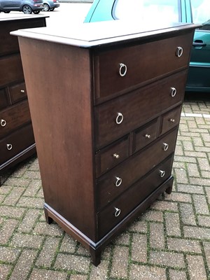 Lot 130 - Stag mahogany Minstrel bedroom furniture to include a pair of tall chest of drawers, pair of bedside chests of four drawers, and a long chest of drawers