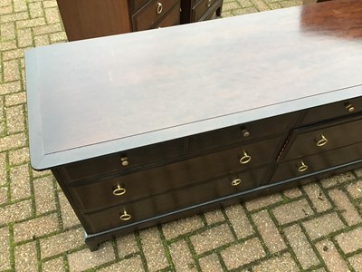 Lot 130 - Stag mahogany Minstrel bedroom furniture to include a pair of tall chest of drawers, pair of bedside chests of four drawers, and a long chest of drawers