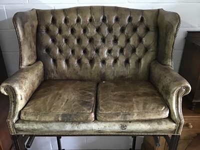 Lot 125 - Good quality Georgian style green leather wing back two-seater settee with buttoned back, loose seat cushions, brass studded edge on moulded square chamfered legs joined by stretchers, approximatel...