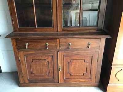 Lot 134 - Good quality Edwardian mahogany two-height bookcase with moulded dentil cornice, the interior with wooden shelves enclosed by bevelled astragal glazed doors with two drawers and panelled cupboards...