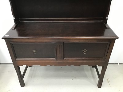 Lot 165 - Oak finished two height dresser with plate rack above and cupboards below on square chamfered legs