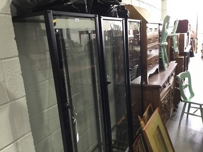 Lot 169 - Three black metal framed glass display cabinets with glass shelves, 45 x 180.5 x 40cm
