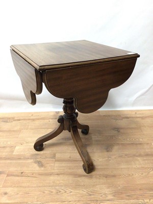 Lot 181 - Regency style mahogany envelope top drop leaf table