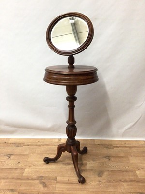 Lot 190 - 19th century mahogany shaving stand with adjustable angle-poise circular mirror on revolving platform with twin compartments, turned column and tripod base