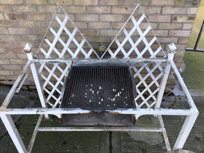 Lot 204 - Bespoke made garden barbecue, white painted with  lattice back and central grill on square section framework with end wheel, 124cm wide x 63cm deep x 123cm high