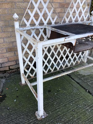 Lot 204 - Bespoke made garden barbecue, white painted with  lattice back and central grill on square section framework with end wheel, 124cm wide x 63cm deep x 123cm high