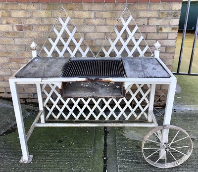 Lot 204 - Bespoke made garden barbecue, white painted with  lattice back and central grill on square section framework with end wheel, 124cm wide x 63cm deep x 123cm high