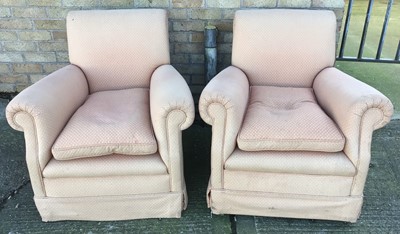 Lot 205 - Pair of early 20th century deep upholstered easy chairs, raised on bun feet and castors