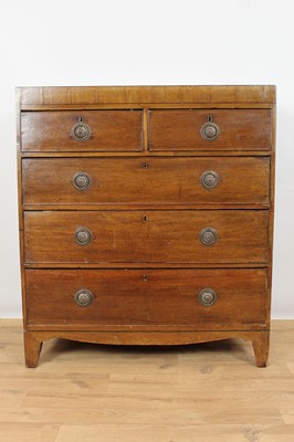 Lot 947 - George IV mahogany chest of two short and three long drawers, with brass ring handles, on bracket feet, 97cm wide x 108cm high x 48cm deep, together with an oval toilet mirror on scroll end standar...