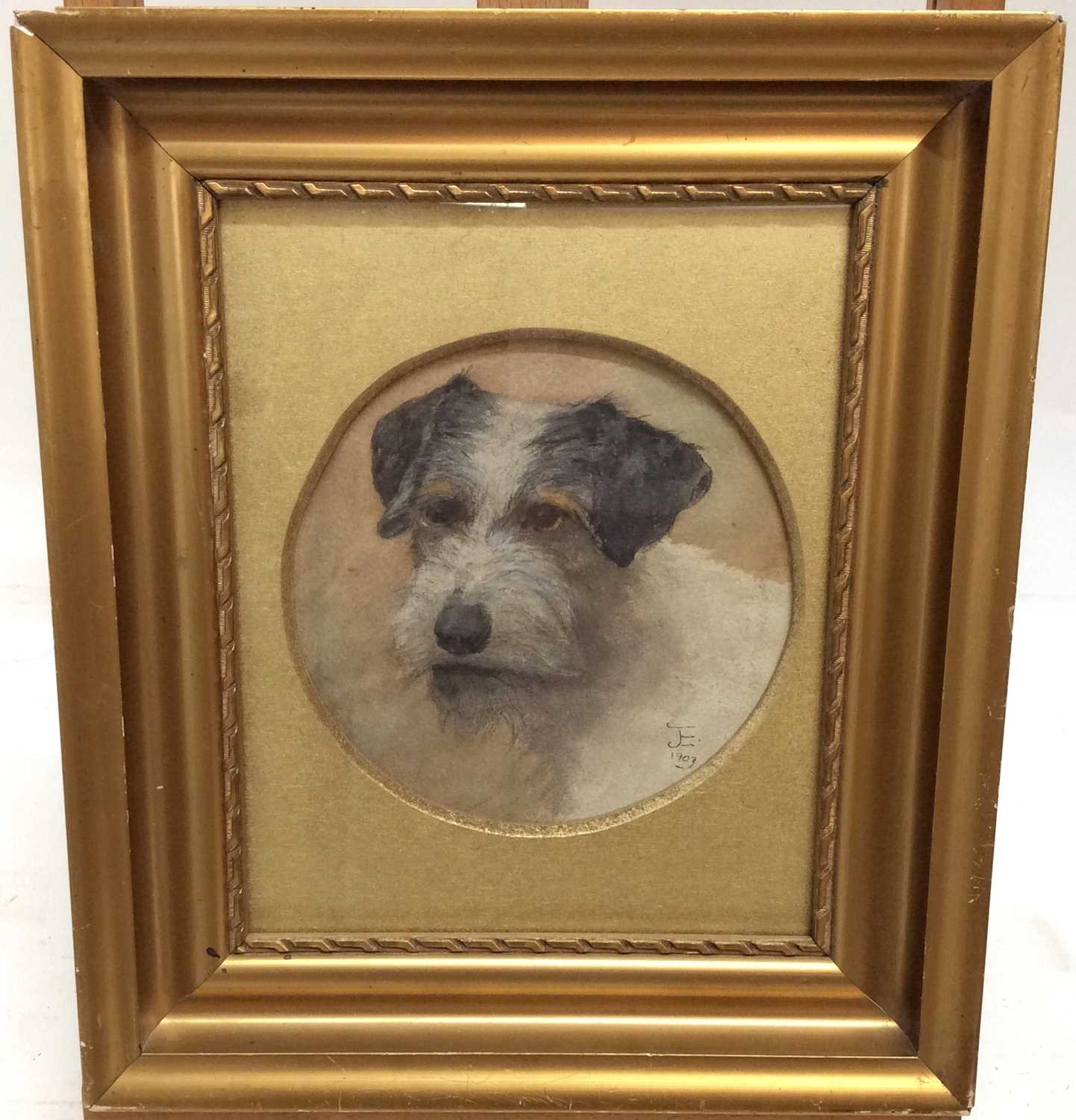 Lot 65 - English School watercolour study- the head of a terrier, monogrammed and dated 1903, within circular mount in gilt frame, diameter 18cm