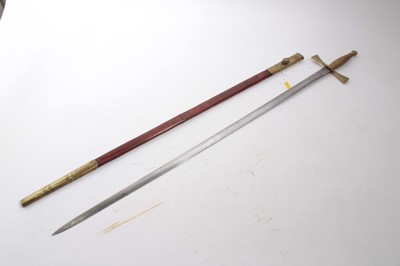 Lot 921 - 19th century Robe sword with brass cruciform hilt and ribbed grip, steel blade with traces of etched decoration, in brass mounted leather scabbard, 89.5cm overall