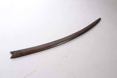 Lot 924 - 19th century Indian Tulwar with disc pommel and curved blade in leather scabbard, 88cm overall