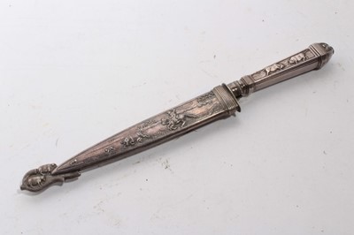 Lot 929 - South American Gaucho Knife / Dagger, etched steel blade by Inox, in silvered scabbard with ornate decoration depicting cattle, 29cm overall