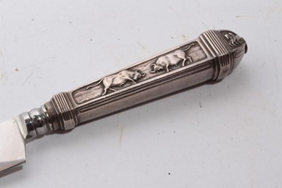 Lot 929 - South American Gaucho Knife / Dagger, etched steel blade by Inox, in silvered scabbard with ornate decoration depicting cattle, 29cm overall