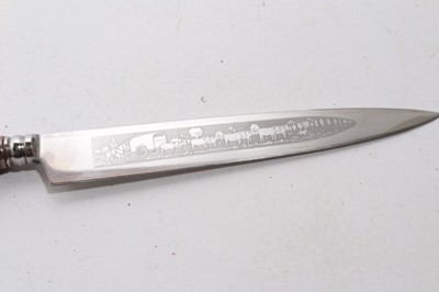 Lot 929 - South American Gaucho Knife / Dagger, etched steel blade by Inox, in silvered scabbard with ornate decoration depicting cattle, 29cm overall