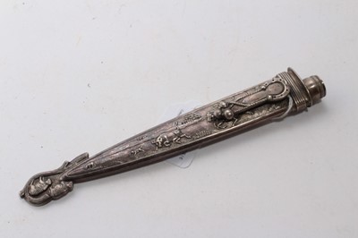 Lot 929 - South American Gaucho Knife / Dagger, etched steel blade by Inox, in silvered scabbard with ornate decoration depicting cattle, 29cm overall