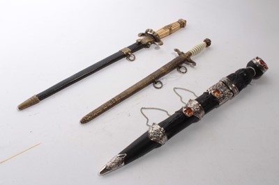 Lot 932 - Replica 19th century-style Scottish Dirk together with two replica Naval Dirks (3)