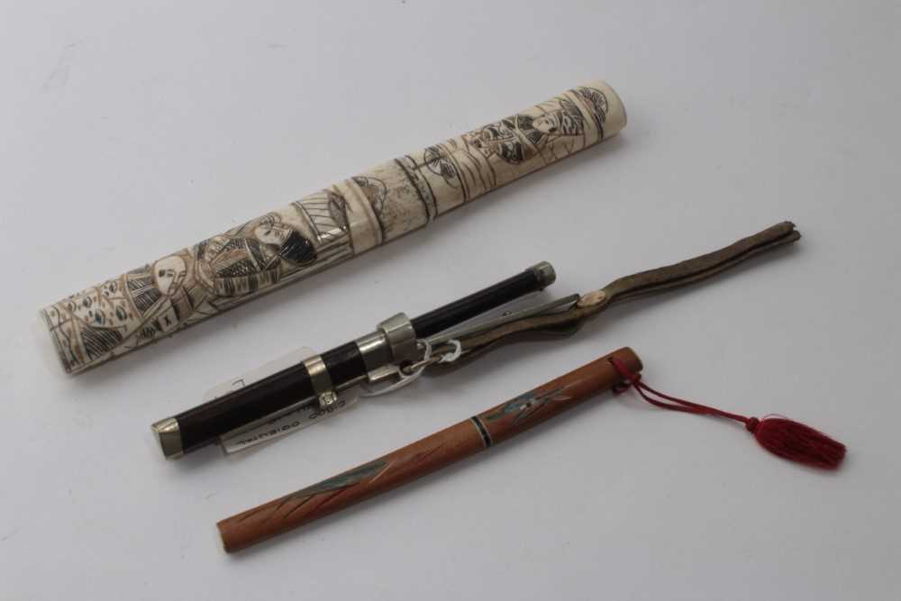 Lot 941 - Japanese Tanto dagger in ornately carved bone scabbard with figure decoration, together with a Japanese miniature Katana letter knife and a Tibetan travelling knife and chopsticks set (3)