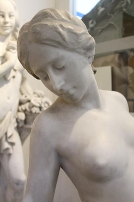 Lot 818 - Antonio Frilli (c1880-1920): Fine late 19th century Italian carved marble sculpture of a scantily clad classical female figure, with balustrade and griffin support 123cm high