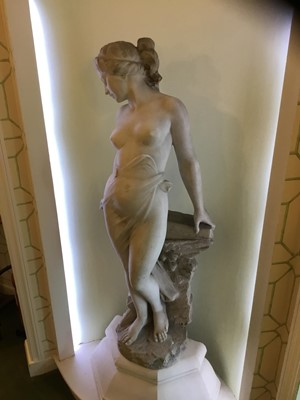 Lot 818 - Antonio Frilli (c1880-1920): Fine late 19th century Italian carved marble sculpture of a scantily clad classical female figure, with balustrade and griffin support 123cm high