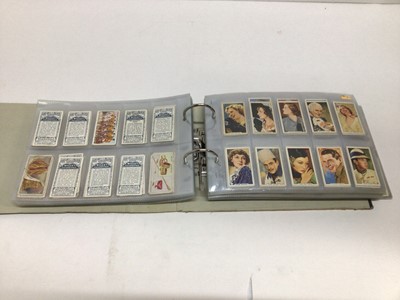Lot 724 - Cigarette cards selection of sets and part sets in five files including Players Cricketers 1938, Ogdens Sea Adventure, Wills Ships Badges, Military Motors, Fish and Bait, Aviation and others