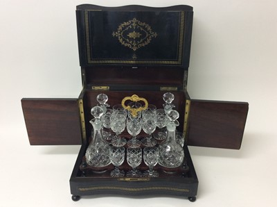 Lot 422 - 19th century brass inlaid ebonised decanter box containing a set of later cut glass decanters and liqueur glasses