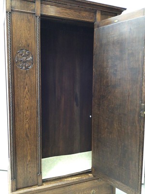 Lot 166 - 1920's carved oak wardrobe by C.W.S. Cabinet Factory Bristol, together with a similar dressing chest, comode and pair of bedroom chairs (5)