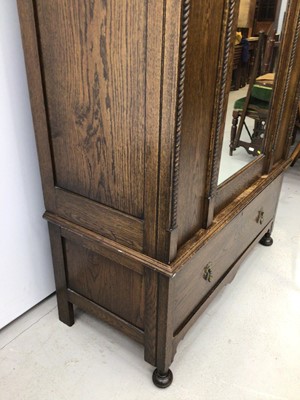 Lot 166 - 1920's carved oak wardrobe by C.W.S. Cabinet Factory Bristol, together with a similar dressing chest, comode and pair of bedroom chairs (5)